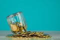 Coins stacks and gold coin money in the glass jar on table with Royalty Free Stock Photo