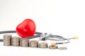 Coins, stethoscope and red heart ,Saving money for Medical expenses and Health care concept Royalty Free Stock Photo