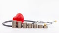 Coins, stethoscope and red heart ,Saving money for Medical expenses and Health care concept Royalty Free Stock Photo