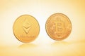 Coins symbols bitcoin and ethereum on a background of golden lights