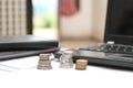 Coins on the table, with laptops and financial reports, version 5