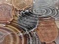 Coins under water Royalty Free Stock Photo