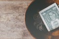 Coins in a wooden bowl, donate and give concept.