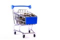 Coint of currency on small shopping trolley. Royalty Free Stock Photo