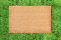 Coir doormat mockup Green grass spring background Royalty Free Stock Photo