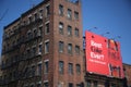 Coke billboard sign near an old brown building under a clear sky in North End, Boston Royalty Free Stock Photo