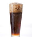 Coke in a glass. Carbonated cold drinks foaming on top after being poured into clear glass Royalty Free Stock Photo