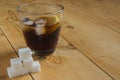 Coke with ice and lemon with sugar cube Royalty Free Stock Photo