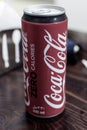 Coke Zero can of pop or soda on a table portrait view