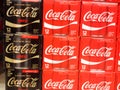 Coke zero classic coca cola cans cases stacked in supermarket background pattern