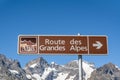 A sign showing the direction of the road of Alps Royalty Free Stock Photo