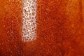 Cola background with bubble, condensation closeup. Macro wet glass.