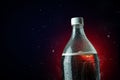 Cola bottle with ice splash on dark background. Soft drink bottle in celebration party concept. Royalty Free Stock Photo