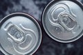 Cola cans on dark background. Top view. Condensate, water drops on two cans with a drink. Royalty Free Stock Photo