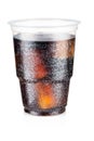 Cola carbonated drink with ice in a plastic cup isolated on white background Royalty Free Stock Photo