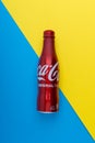 Cola or coke drink on a blue and yellow background