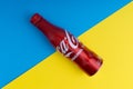 Cola or coke drink on a blue and yellow background