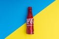 Cola or coke drink on a blue and yellow background