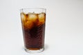 Cola coke in highball glass with ice cubes isolated on white background including clipping path. Royalty Free Stock Photo