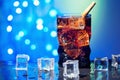 Cola in drinking glass with ice cube sweet sparkling carbonated drink beverage fast food with big calorie Royalty Free Stock Photo