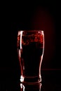 Cola glass with ice cubes and droplets, isolated on black background Royalty Free Stock Photo