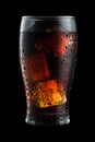 Cola glass with ice cubes and droplets Royalty Free Stock Photo
