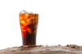 Cola with in glass with ice cubes on sand, nature background Royalty Free Stock Photo