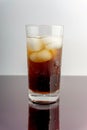 Cola - cola and ice cubes in glass on white background Royalty Free Stock Photo