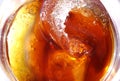 Cola with ice cubes and lemon