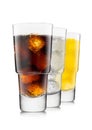 Cola with lemonade and orange soda soft drink with ice cubes in luxury glasses Royalty Free Stock Photo