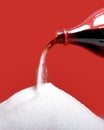 Cola refreshing drink bottle neck pouring the liquid as its transforming into pure white sugar Royalty Free Stock Photo