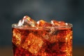 Cola soda drink in glass with ice cubes and bubbles, macro photo Royalty Free Stock Photo