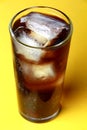 Cola soda poured in a glass with ice cubes Royalty Free Stock Photo