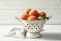 Colander with delicious ripe peaches