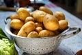 Colander filled with potatoes