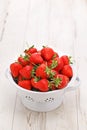 A colander full of Beautiful freshly picked strawberries