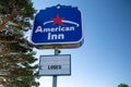 Sign for a closed and abandoned American Inn hotel off of Interstate 70