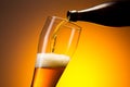 Wheat beer pouring out of a bottle Royalty Free Stock Photo