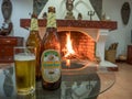 A cold beer in front of the fire