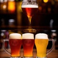 Cold beer pour in glass from crane in pub background Royalty Free Stock Photo