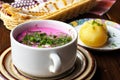 Cold beetroot soup with green onion, dill and hot potatoes