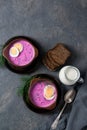 Cold beetroot soup okroshka with kefir served with eggs, dill and bread slices, rustic background, top view Royalty Free Stock Photo