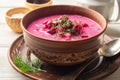 Cold borscht or Holodnik, traditional summer beet soup in ceramic bowl on wooden background Royalty Free Stock Photo