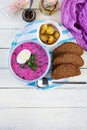 Cold borscht on white wooden background. Cold beet soup. Top view Royalty Free Stock Photo