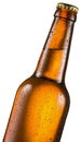 Cold bottle of beer with condensated water drops on it. Royalty Free Stock Photo