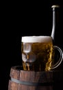 Cold bottle and glass of craft beer on old barrel Royalty Free Stock Photo