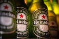 Marinette,WI / U.S.A. - Aug16,2019: Cold bottles of Heineken Beer with drops over green background. Heineken is the flagship produ