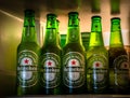 Marinette,WI / U.S.A. - Aug16,2019: Cold bottles of Heineken Beer with drops over green background. Heineken is the flagship produ Royalty Free Stock Photo