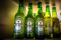 Marinette,WI / U.S.A. - Aug16,2019: Cold bottles of Heineken Beer with drops over green background. Heineken is the flagship produ Royalty Free Stock Photo