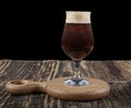 Cold brew coffee.Tasty ice coffee with milk , cold drink in glass on wooden background. Copy space